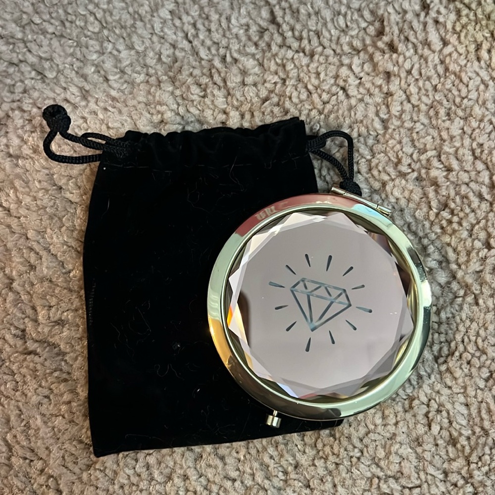 Pink and gold compact mirror